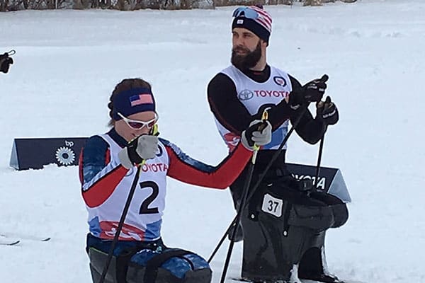 Paralympic athletes practicing nordic skiing